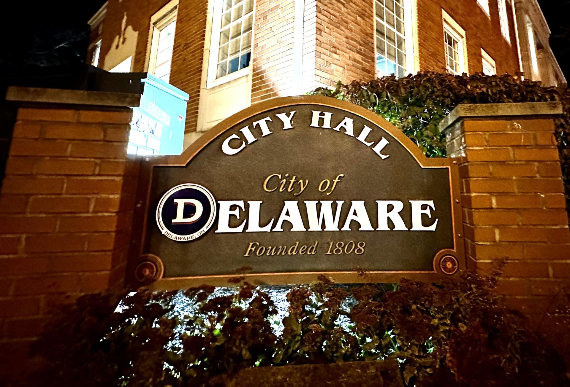 City hall sign at night